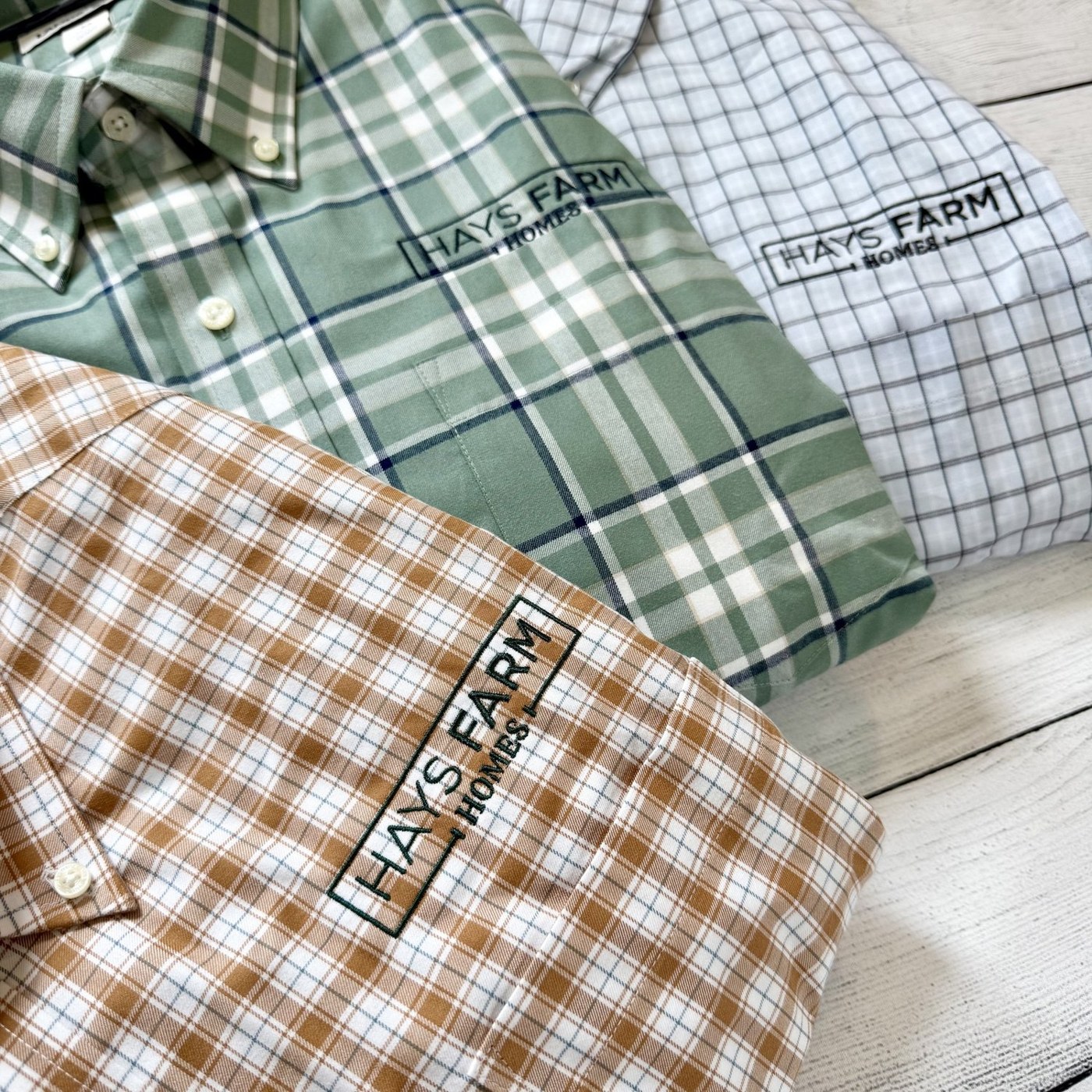 Three checked shirts with embroidered Hays Farm logos, made by Blue Clover Co.